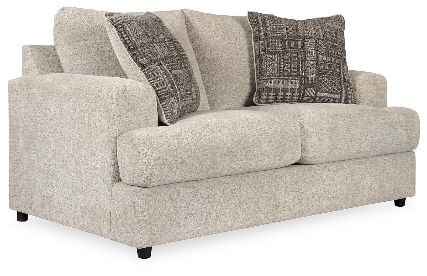 Matching contemporary loveseat with soft chenille upholstery, decorative accent pillows, and plush foam cushioning.