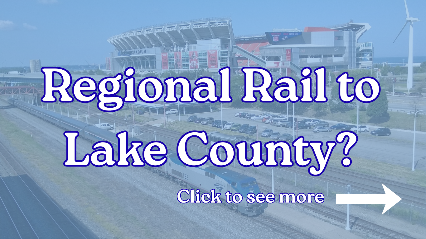 A train passing through a city with a stadium in the background and a wind turbine on the right. Overlaid text asks, 'Regional Rail to Lake County?' and 'Click to see more' with a white arrow pointing to the right.