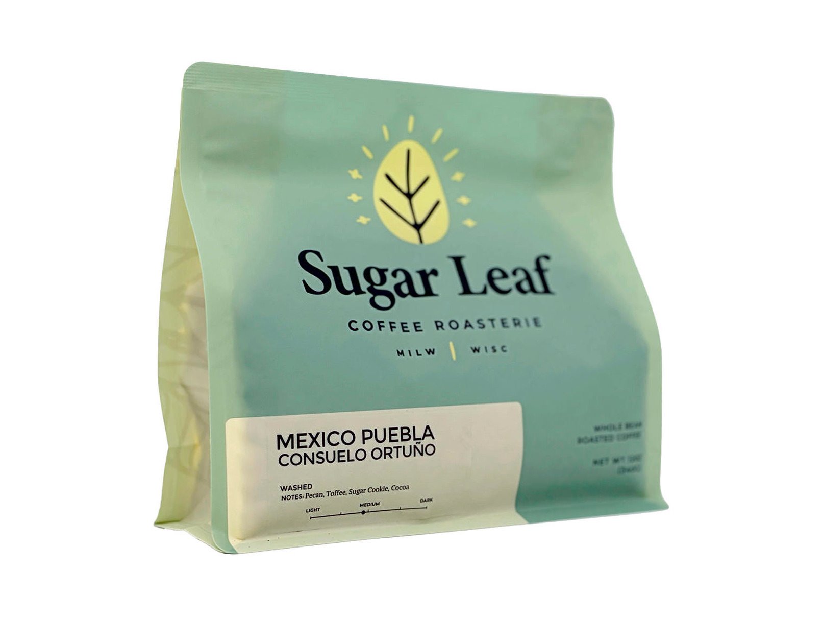 Angled view of a teal and cream 12 oz bag of Sugar Leaf Mexico Puebla Consuelo Ortuño whole bean coffee