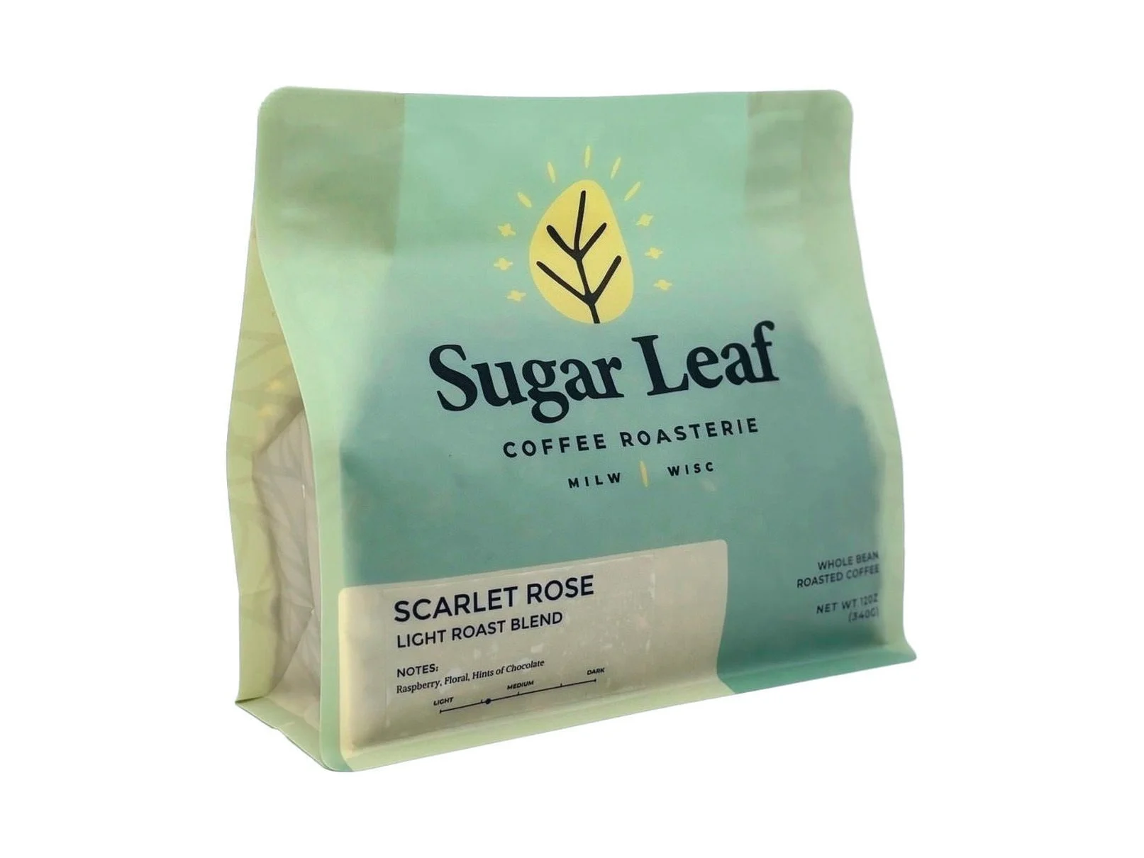 Angled view of a teal and cream 12 oz bag of Sugar Leaf Scarlet Rose Light Roast Blend whole bean coffee