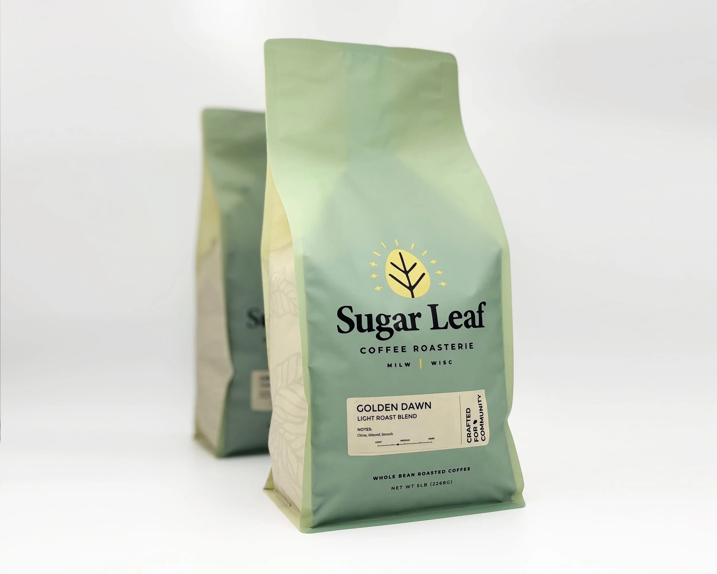 Two large bags of Sugar Leaf Golden Dawn coffee