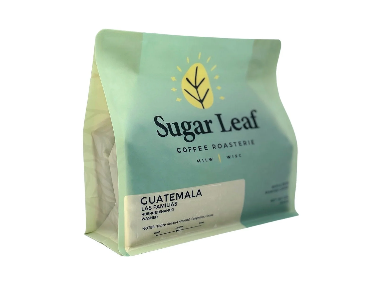 Angled view of a teal and cream 12 oz bag of Sugar Leaf Guatemala Las Familias Huehuetenango whole bean coffee