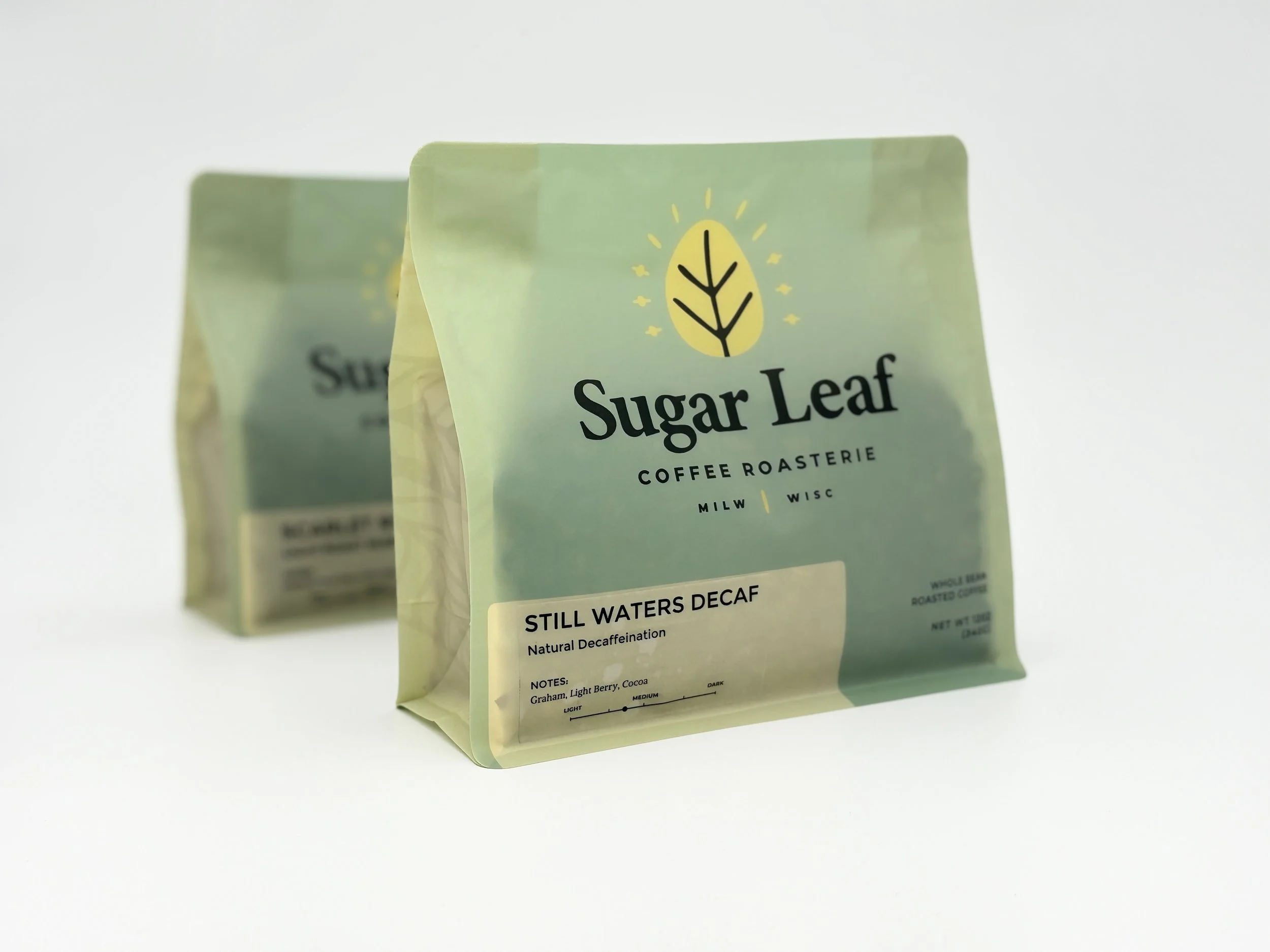 Two bags of Sugar Leaf Still Waters Decaf coffee blend