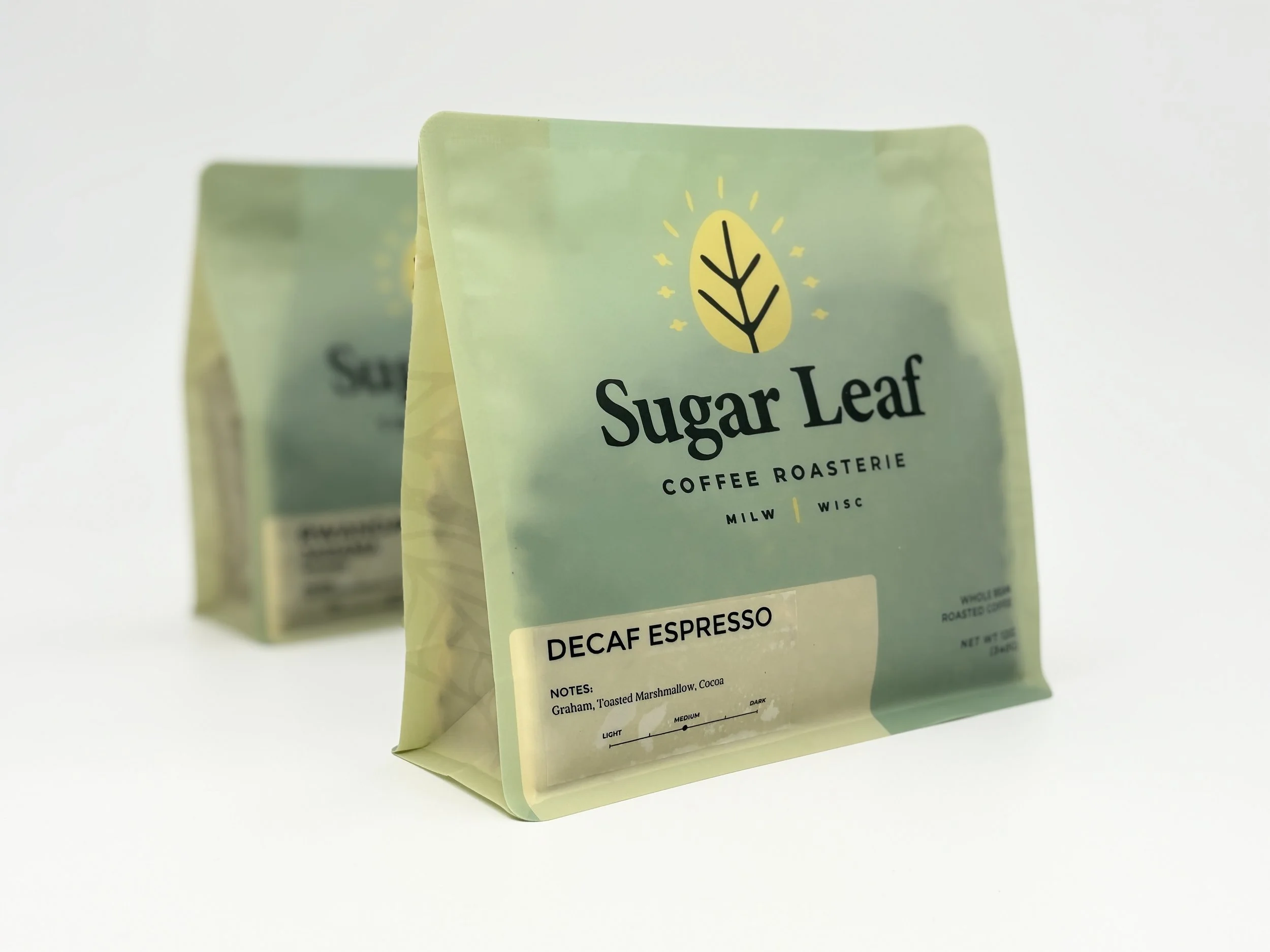 Two bags of Sugar Leaf Decaf Espresso coffee