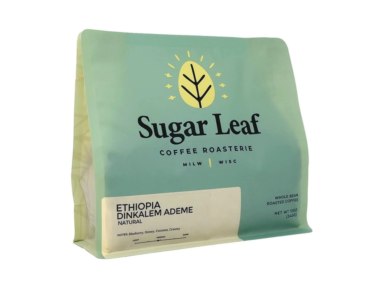 Angled view of a teal and cream 12 oz bag of Sugar Leaf Ethiopia Dinkalem Ademe whole bean coffee