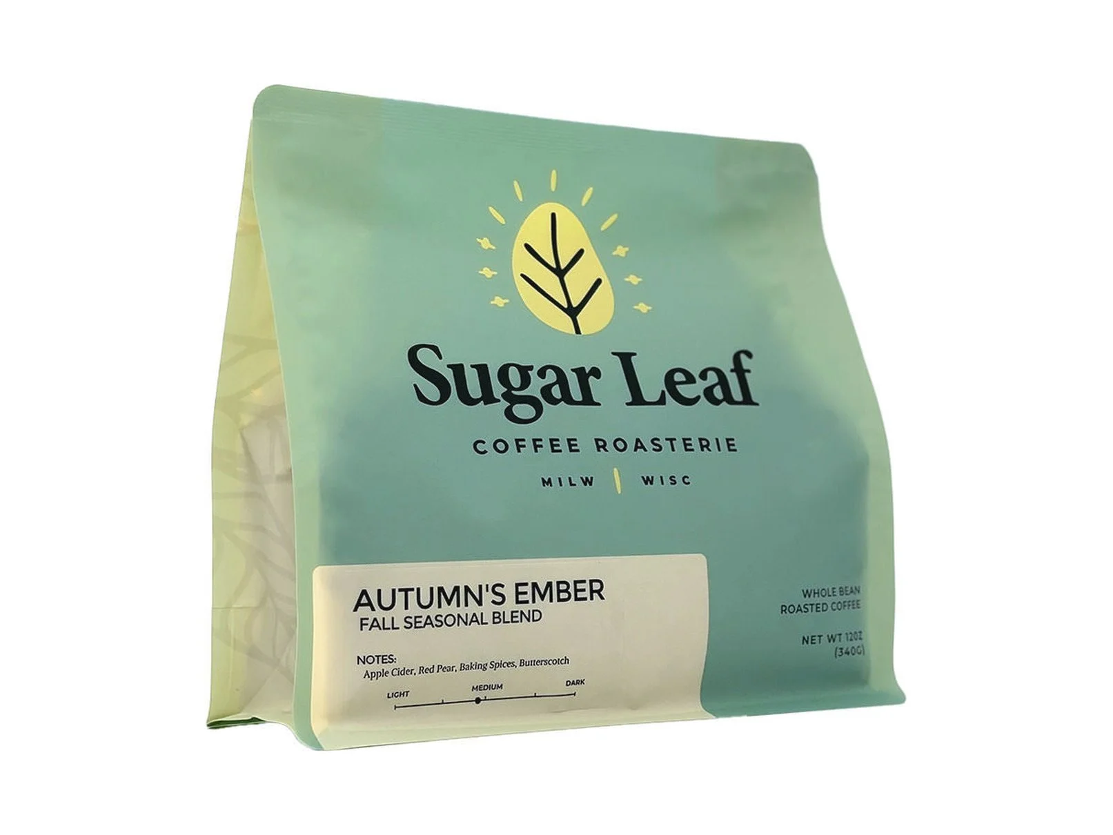 Angled view of a teal and cream 12 oz bag of Sugar Leaf Autumn's Ember Fall Seasonal Blend whole bean coffee