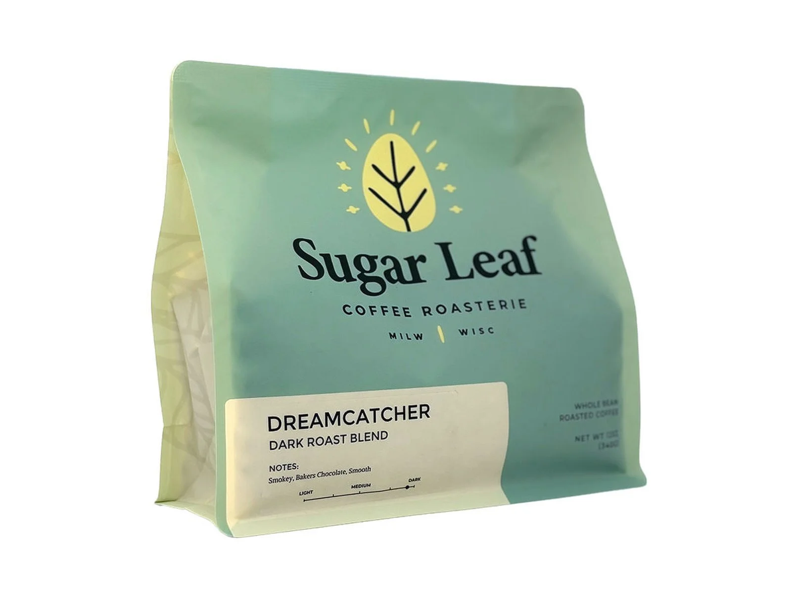 Angled view of a teal and cream 12 oz bag of Sugar Leaf Dreamcatcher Dark Roast Blend whole bean coffee
