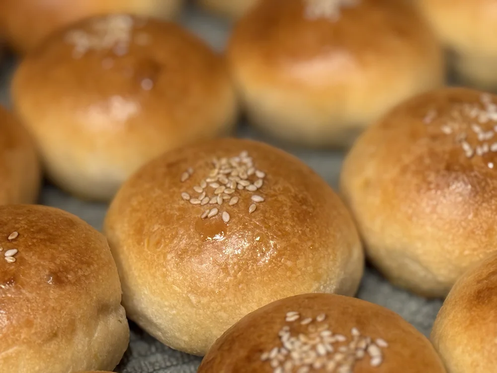 Golden bread rolls topped with coarse salt.