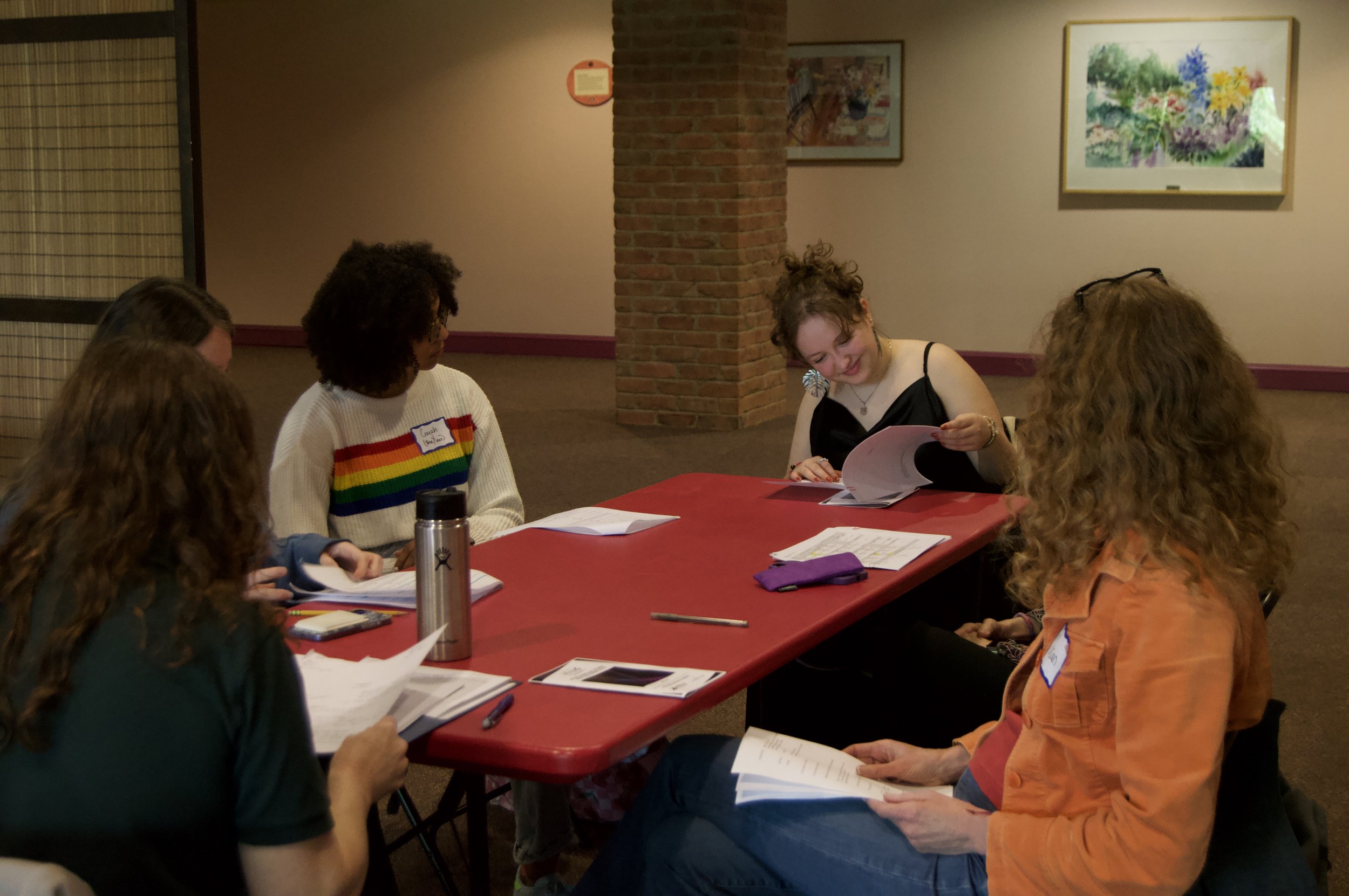 students, cast, and director reading during rehearsal for Vermont Young Playwrights, 2025.