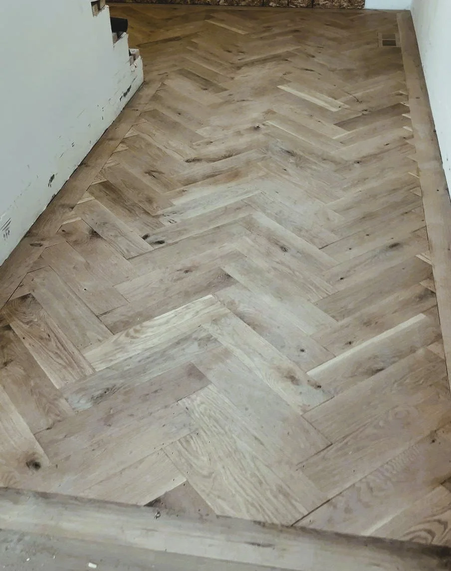 Herringbone flooring process install.jpeg
