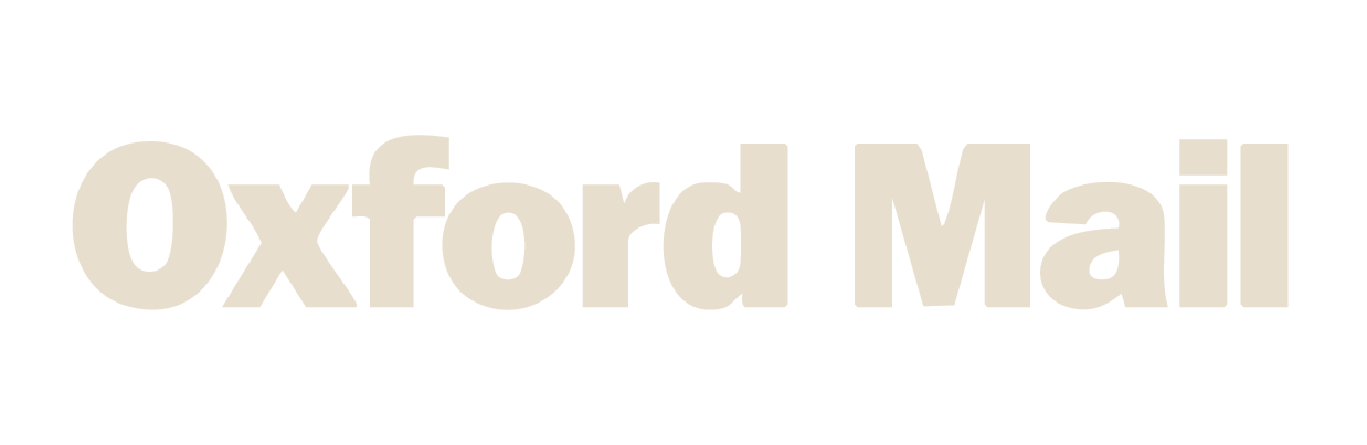 Logo of Oxford Mail newspaper in beige text.