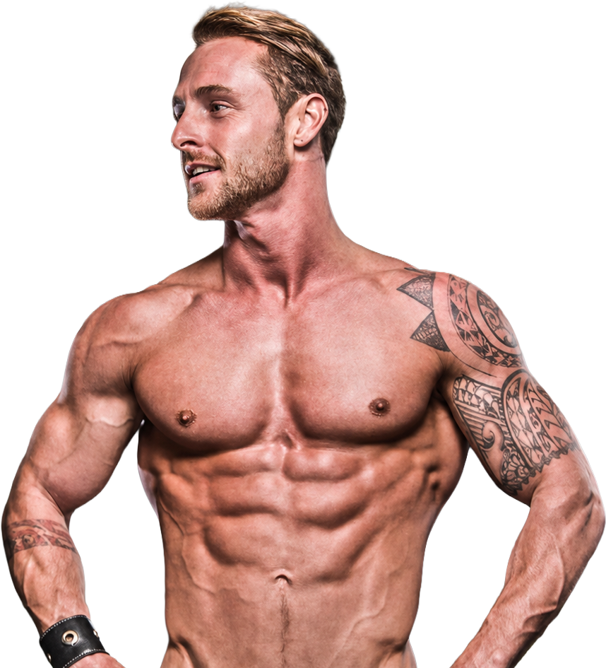 A shirtless muscular man with tattoos on his left arm and shoulder, looking to the right with a confident expression.