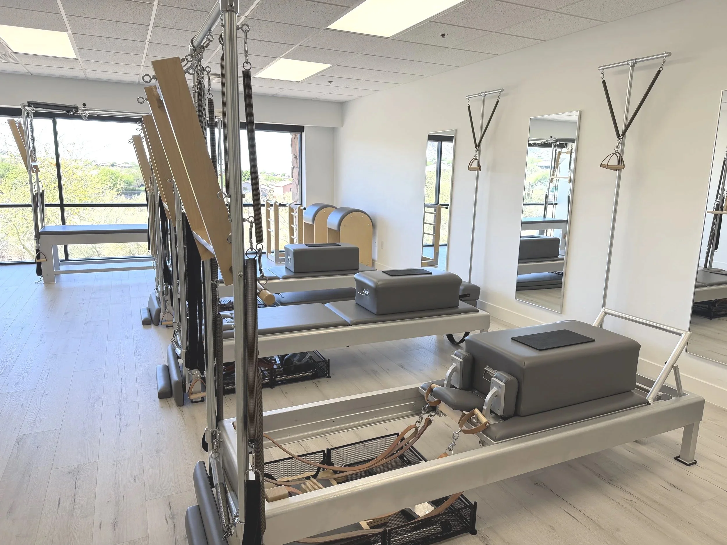 Bright TruForm Pilates Scottsdale studio with Classical Reformers and apparatus.