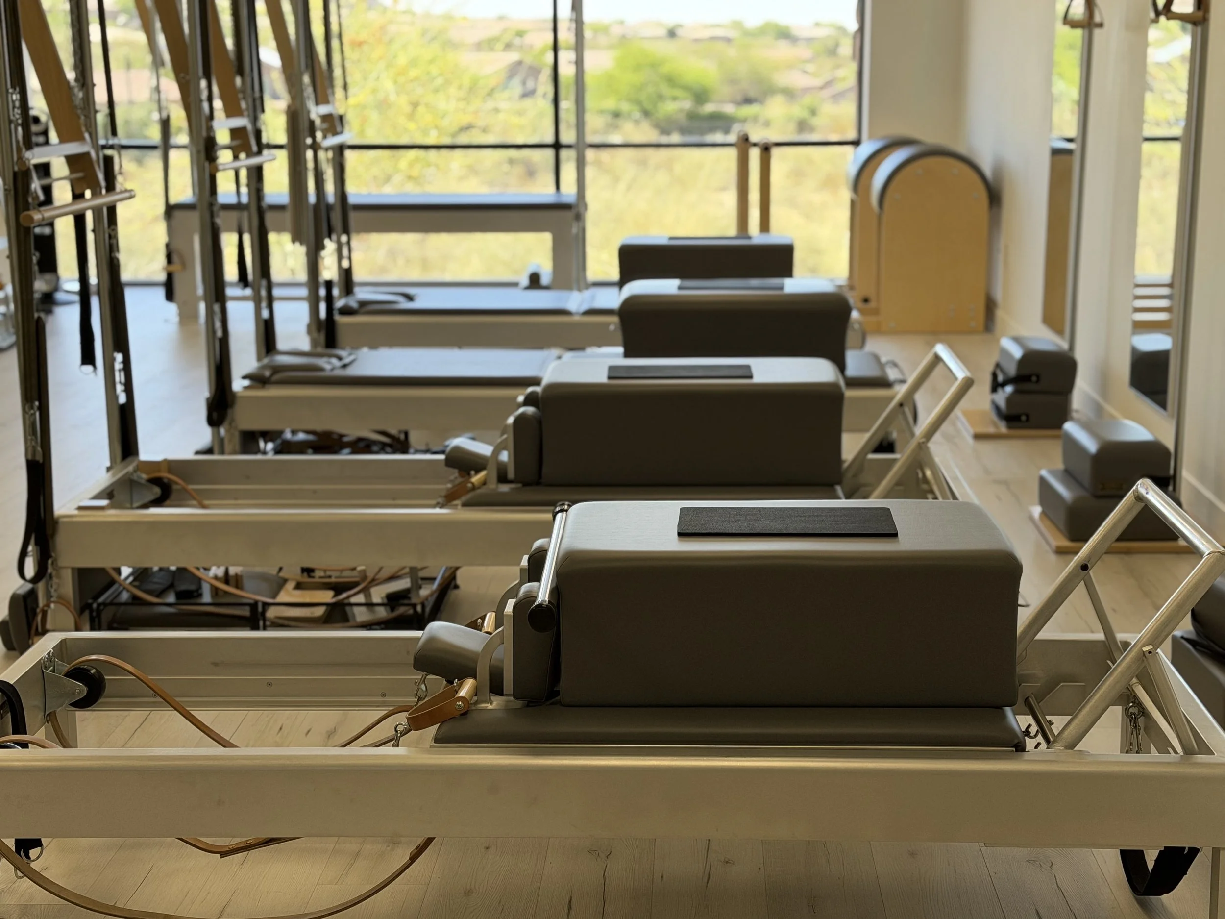 Bright Classical Pilates studio in Scottsdale Arizona with traditional apparatus setup