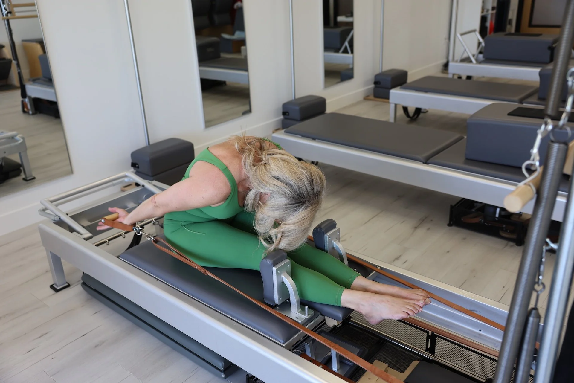 Client working on Reformer during Private Pilates at TruForm Pilates