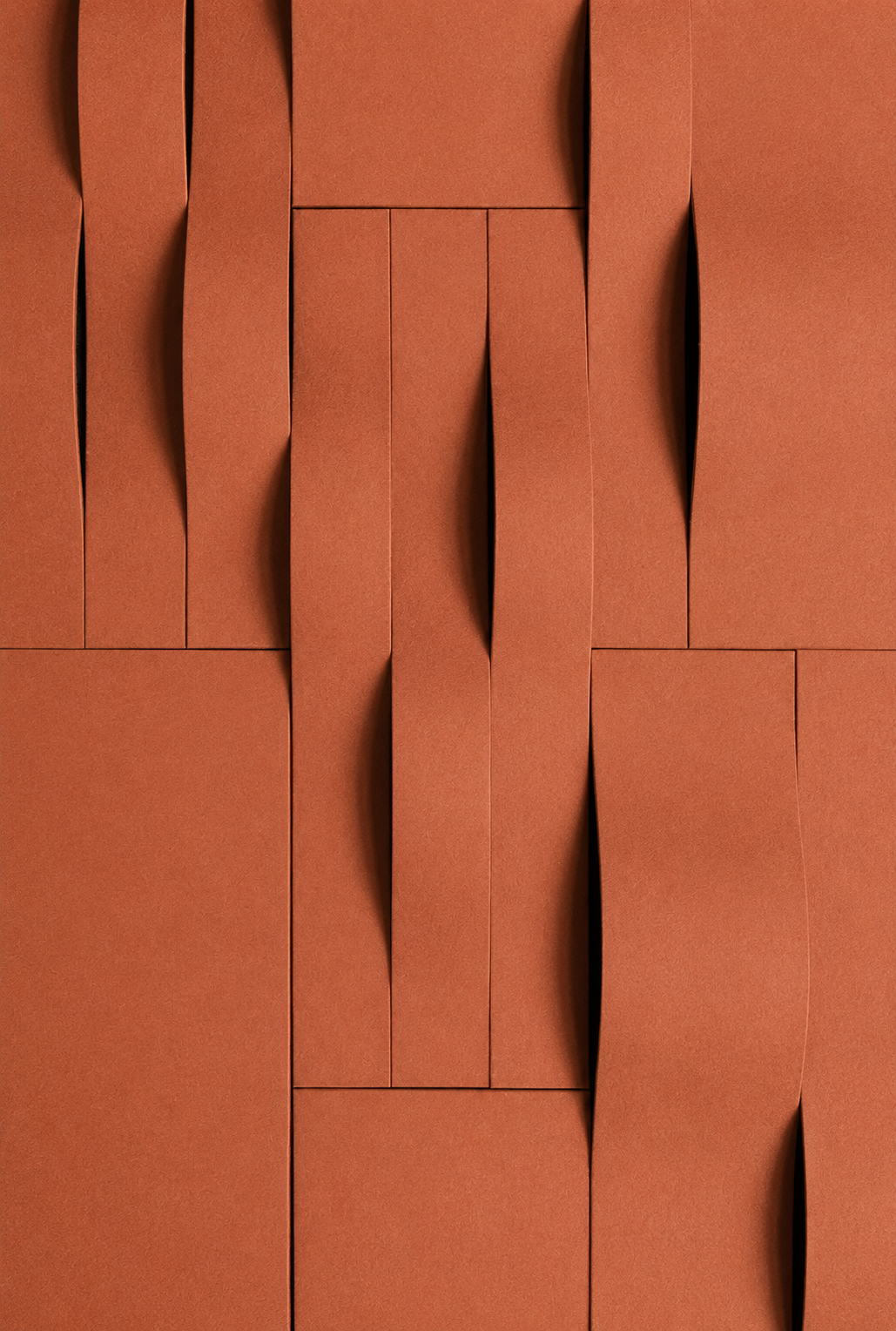 Close-up of stacked reddish-brown paper sheets with curled edges, creating geometric layers and shadows.
