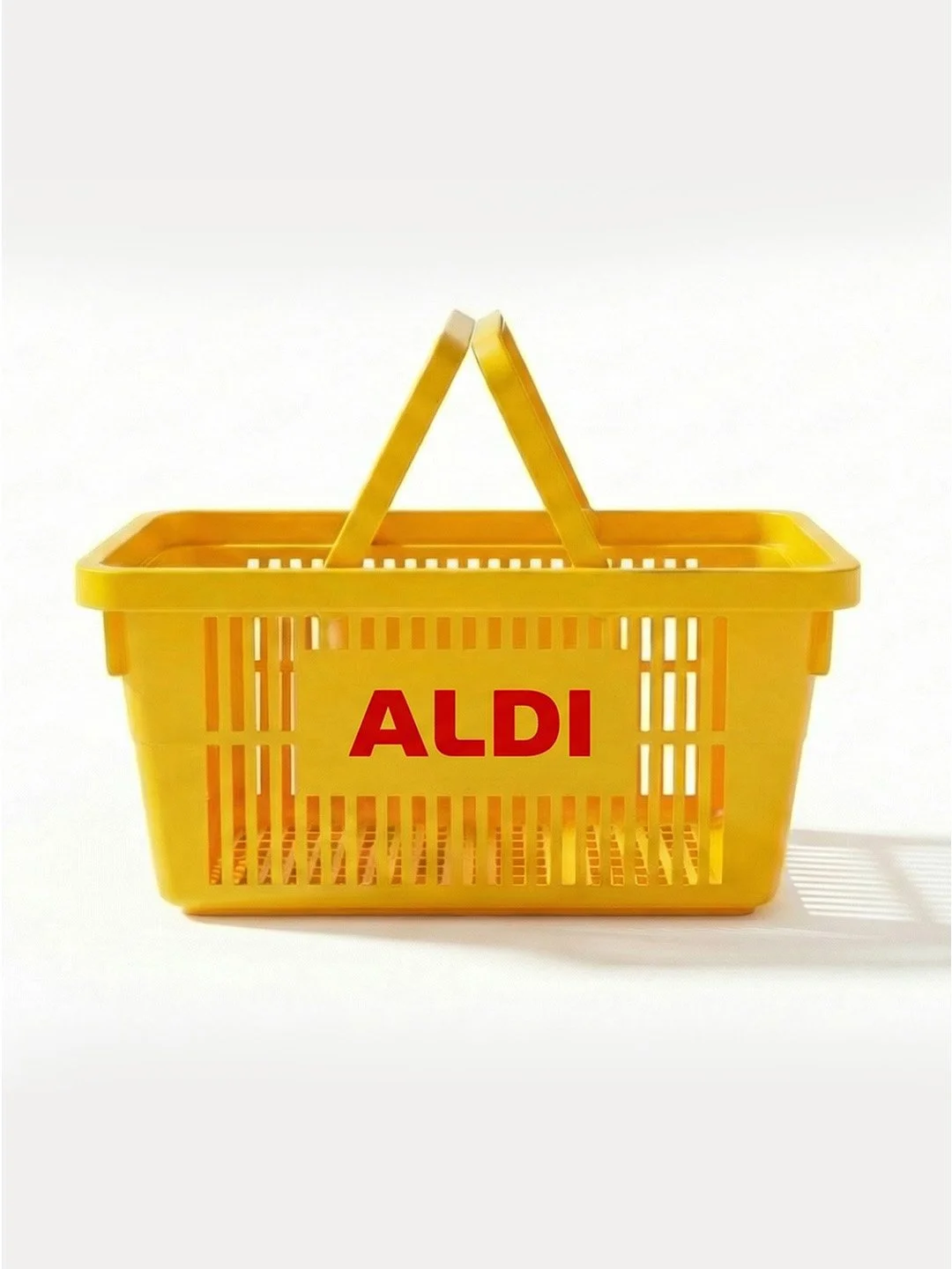Yellow plastic shopping basket with the word 'ALDI' in red letters on the front, isolated on a white background.