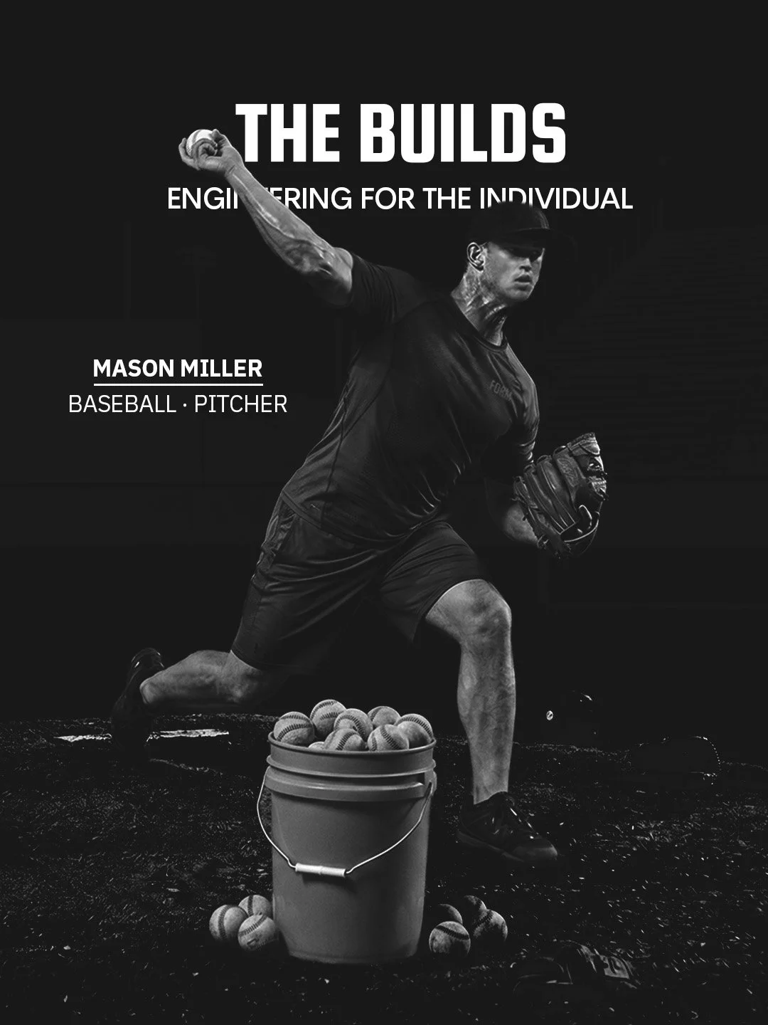 Black and white photo of a baseball pitcher in a dynamic pitching pose, with a bucket of baseballs in front.