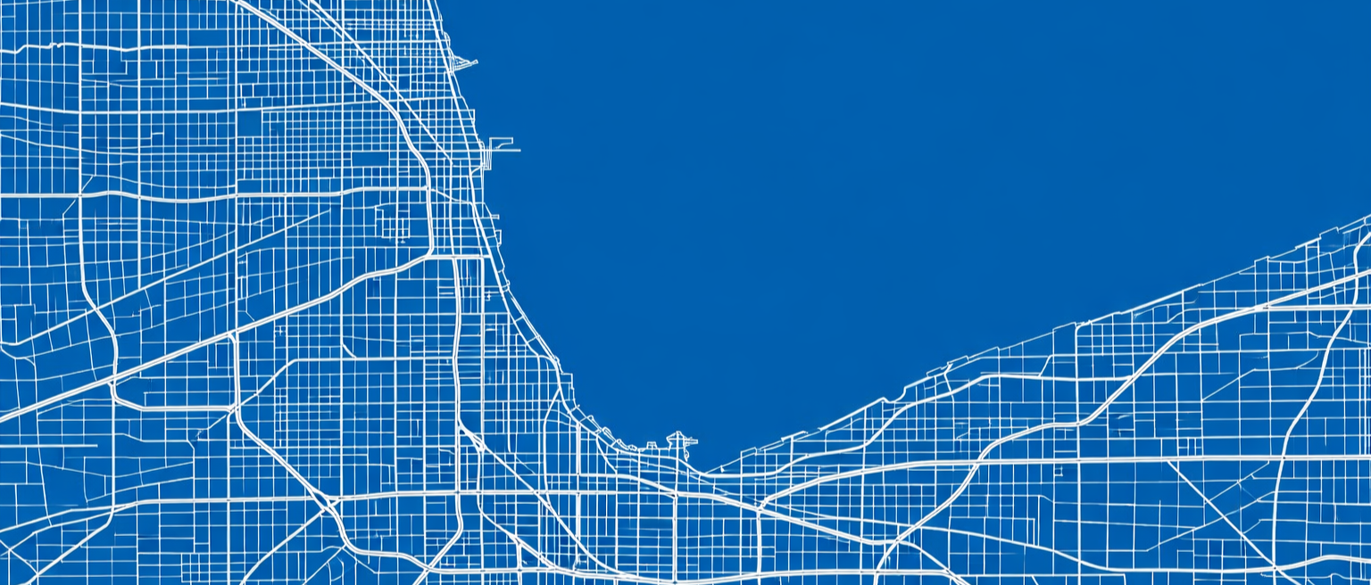 Map of a city with a grid street layout, including streets and a body of water to the north.