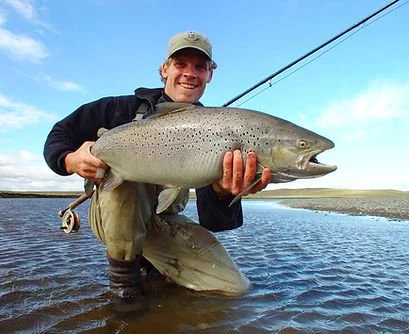 Jeremy Stott holding a golden dorado on the Rio in northern Argentina — fly fishing guide and tyer based in Glenwood Springs