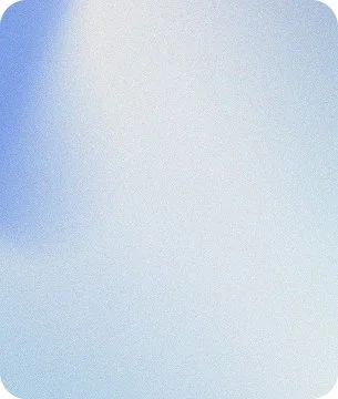 A blurred, light blue and white abstract background with no discernible objects.