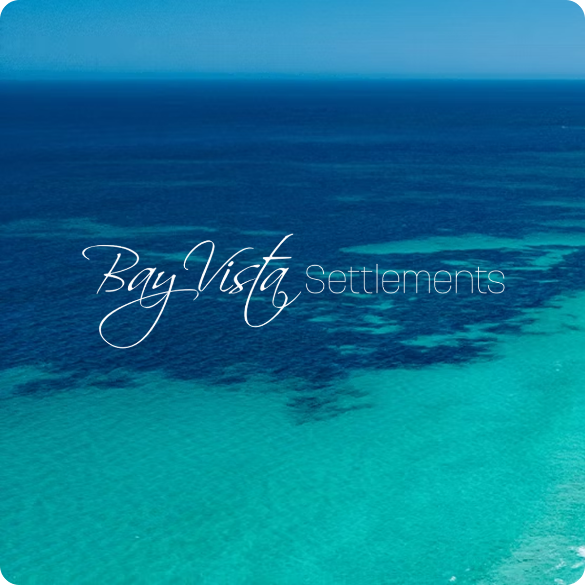 Aerial view of a bay with turquoise water in the foreground and deeper blue water in the background, overlaid with the text 'Bay Vista Settlements'.