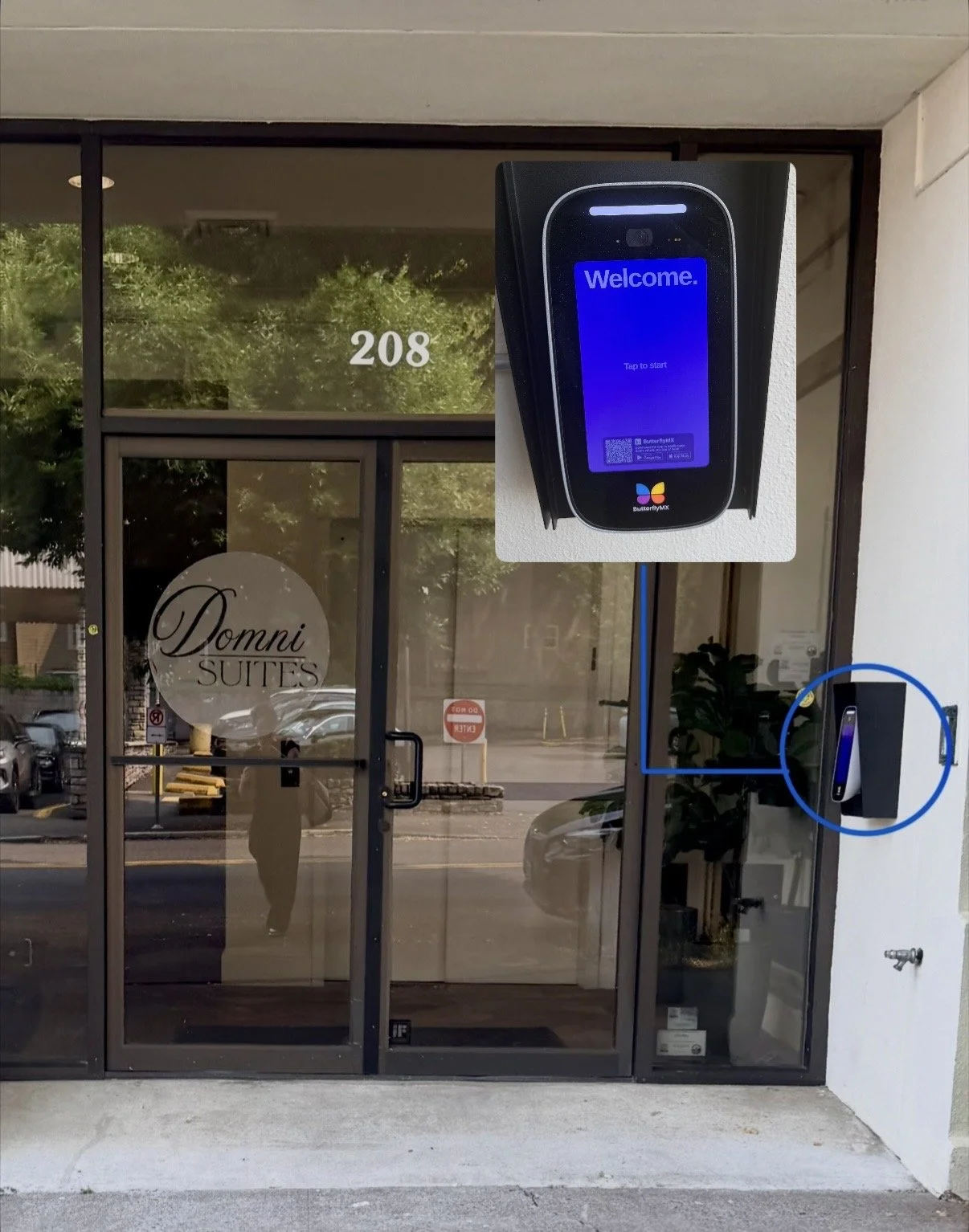 exterior of double glass doors with inset photo of a callbox