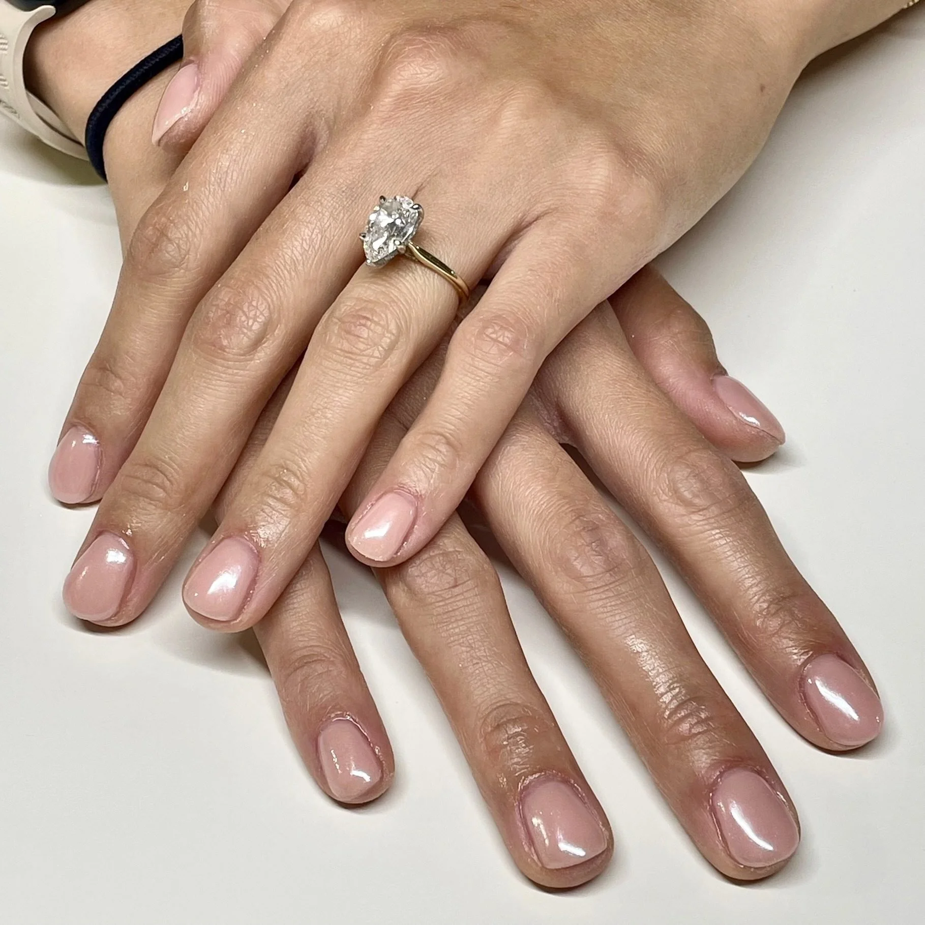 Short light pink nails with chrome powder