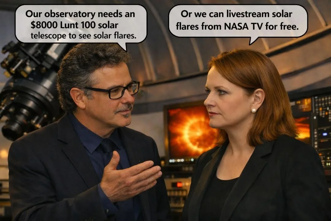 A man and woman in conversation inside an observatory, with a telescope and electronic equipment in the background. The man states they need an $8000 Lunt 100 solar telescope to see solar flares, and the woman suggests livestreaming solar flares from NASA TV for free.