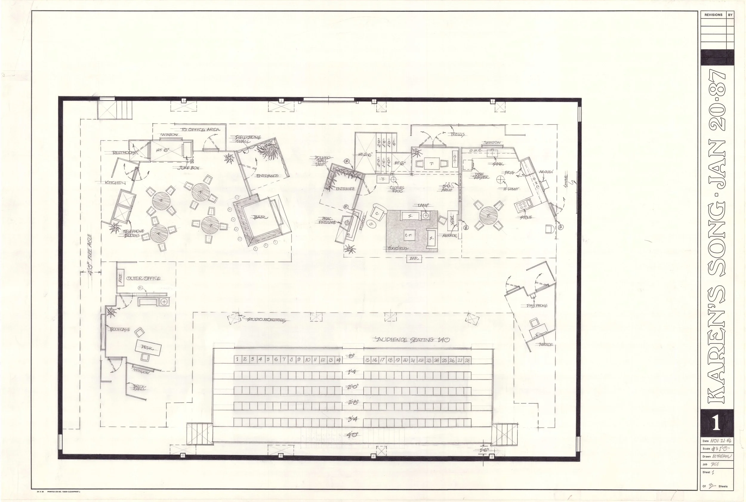 Architectural blueprint of a building with detailed room layouts, furniture placement, and annotations.