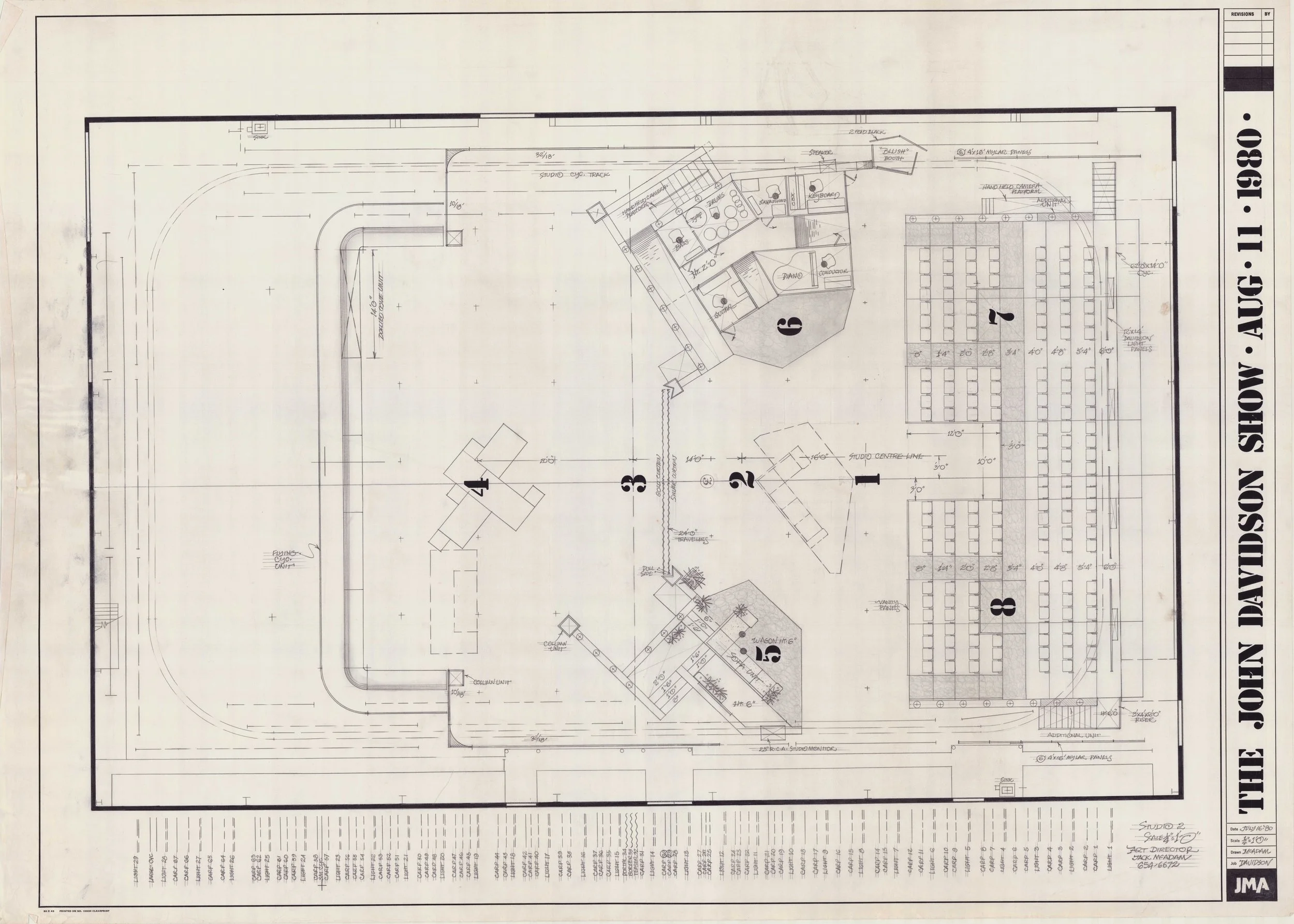 Architectural blueprint of a building layout with detailed measurements, labeled rooms, and construction information.