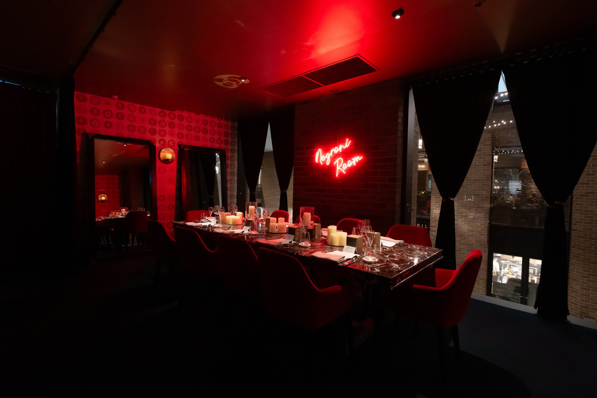 Photo of Negroni room, a private dining room with striking marble table for up to 10 seated guests at Bar Conte Sydney CBD, perfect for milestones birthdays and special occasions
