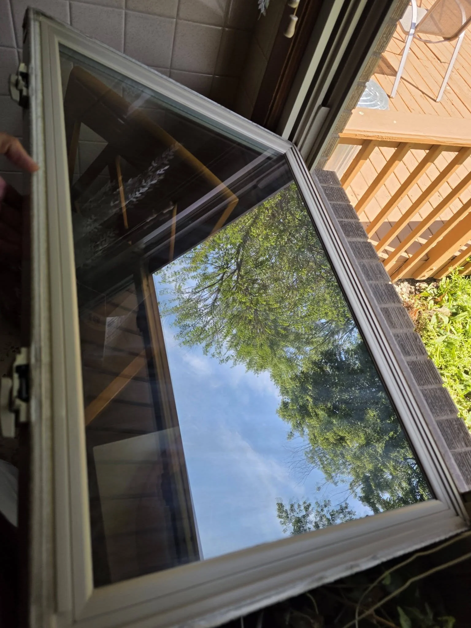 Close-up of a clean glass window with a white frame