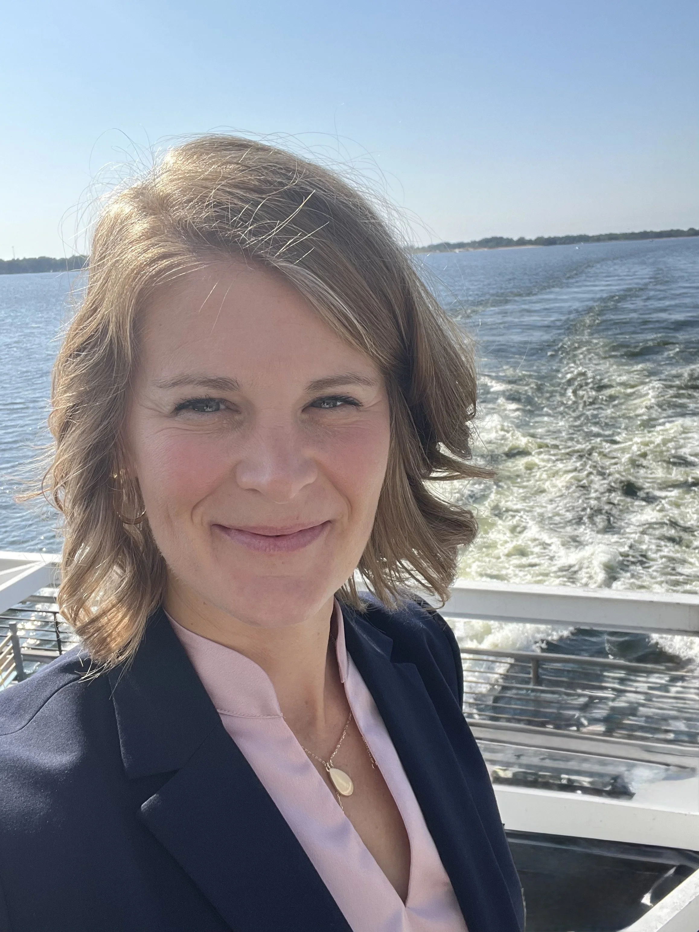 Rhonda Hoyer, healthcare executive and executive coach with lake behind her.