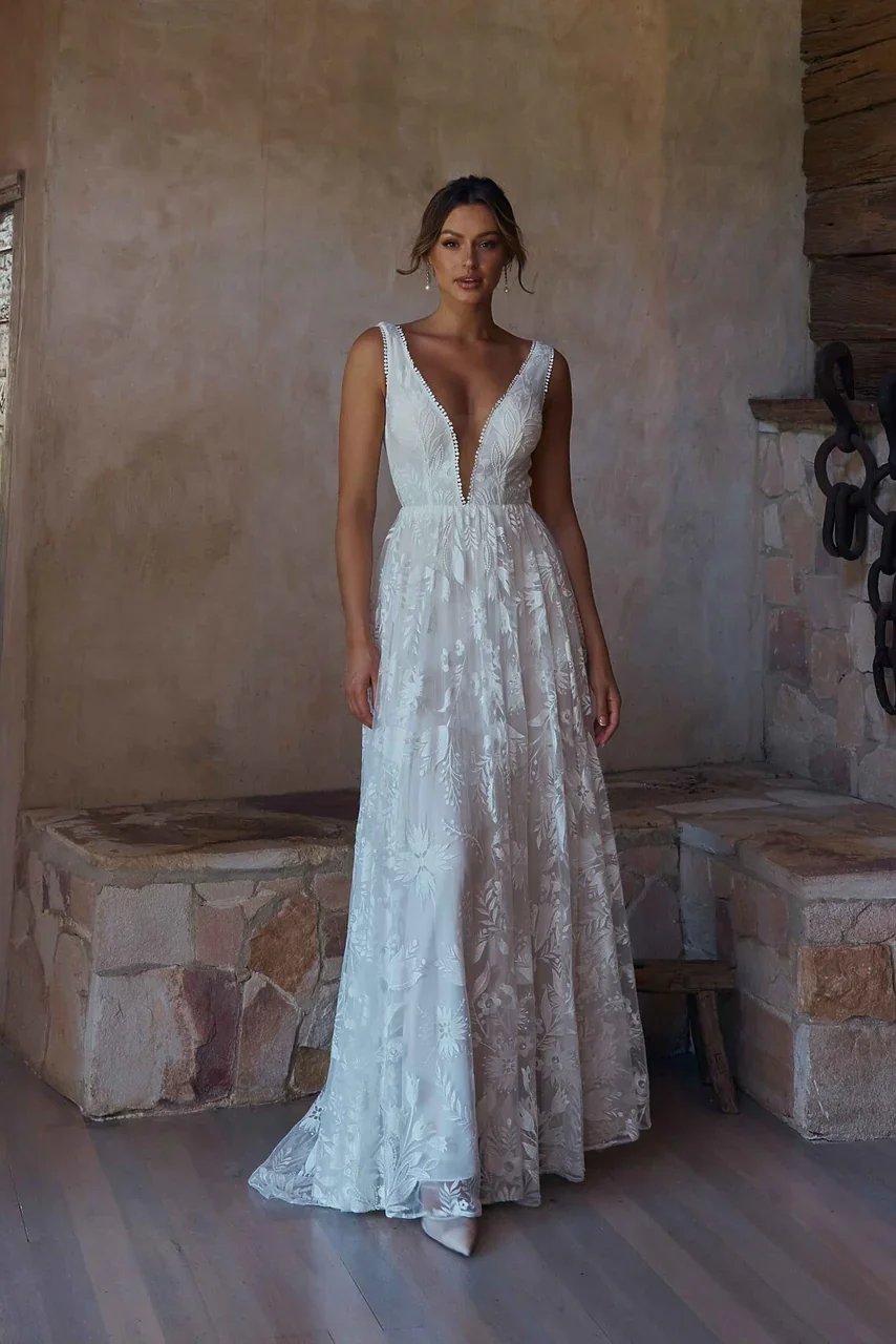 ANDROMEDA-TC2346-WEDDING-DRESS-VINTAGE-WHITE-LACE-ON-BODICE-AND-SKIRT-WITH-PLUNGING-NECKLINE-AND-BACK-TANIA-OLSEN-BRIDAL.jpg.webp