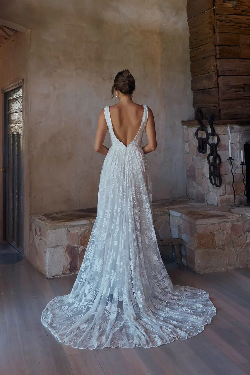 ANDROMEDA-TC2346-WEDDING-DRESS-VINTAGE-WHITE-LACE-ON-BODICE-AND-SKIRT-WITH-PLUNGING-NECKLINE-AND-BACK-TANIA-OLSEN-BRIDAL-1.jpg.webp