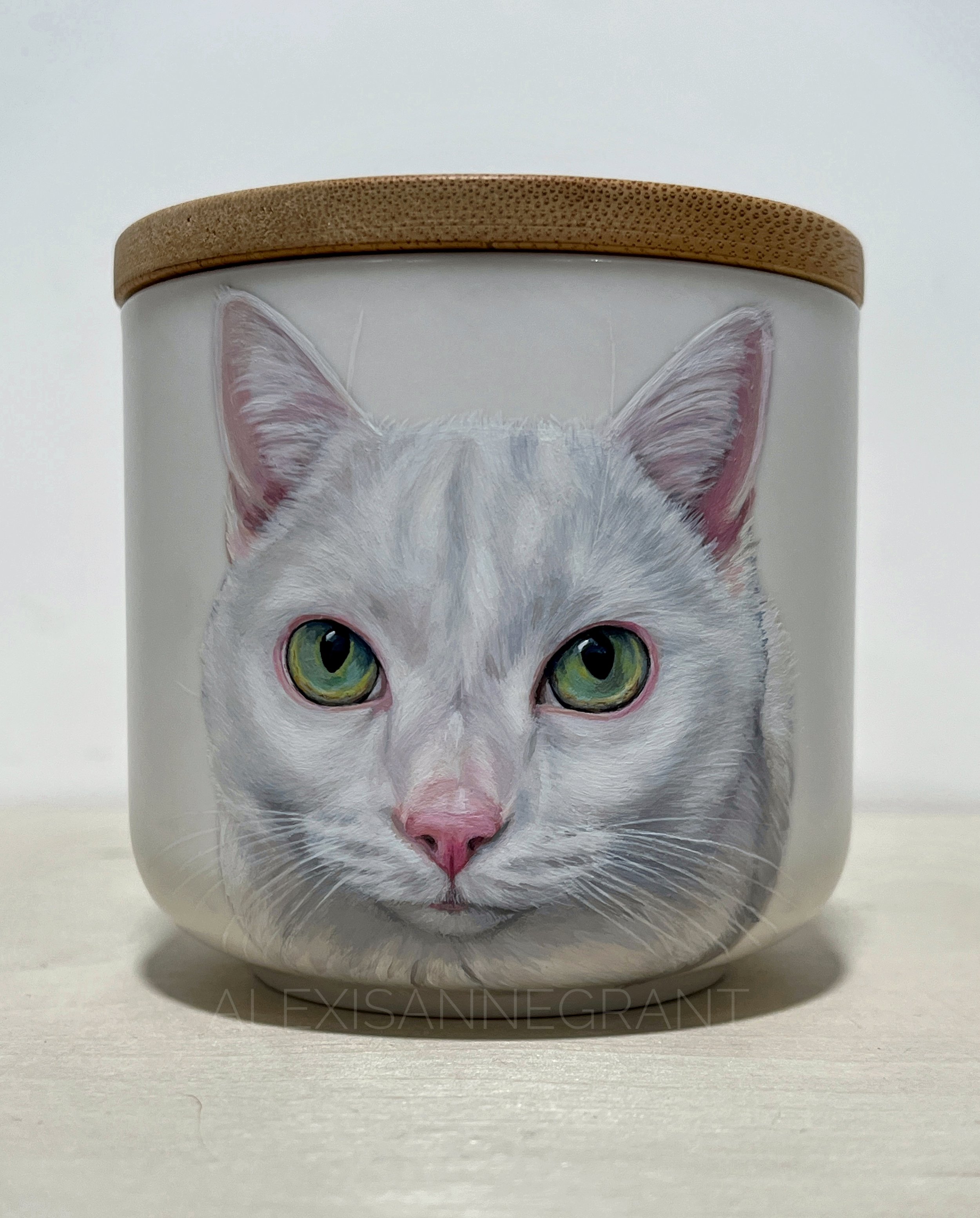 white cat portrait urn hand painted pet portrait on ceramic jar with wood lid white cat has green eyes this is hand painted from photo