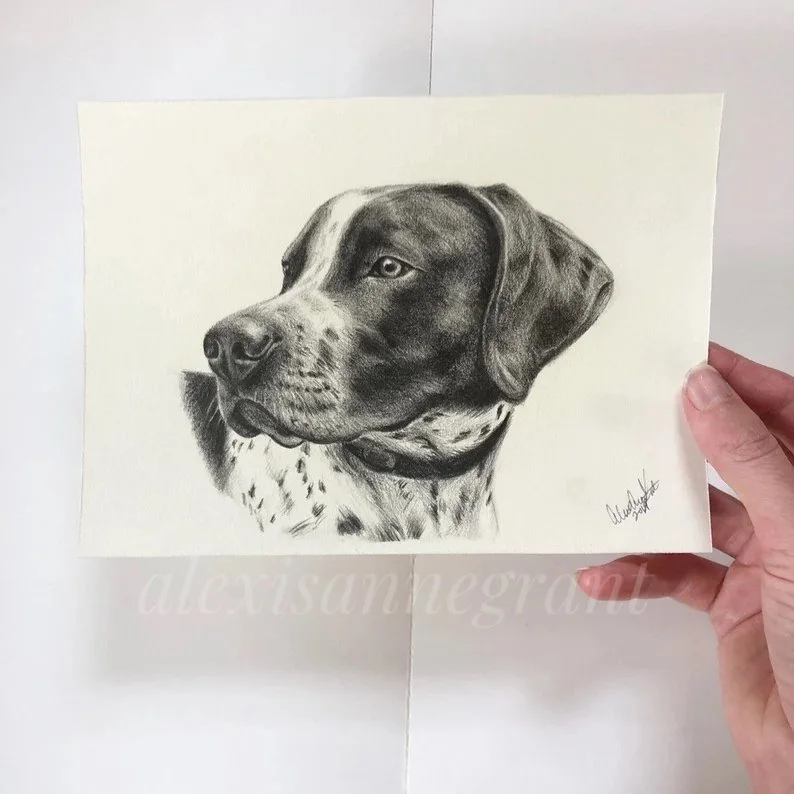 small hand held portrait drawing on paper black and white graphite portrait by Alexis Anne grant