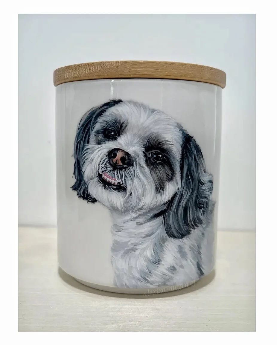 custom dog portrait urn hand painted black and white small pet painting. White ceramic jar with wood lid adorned with a portrait of a dog hand painted from photos