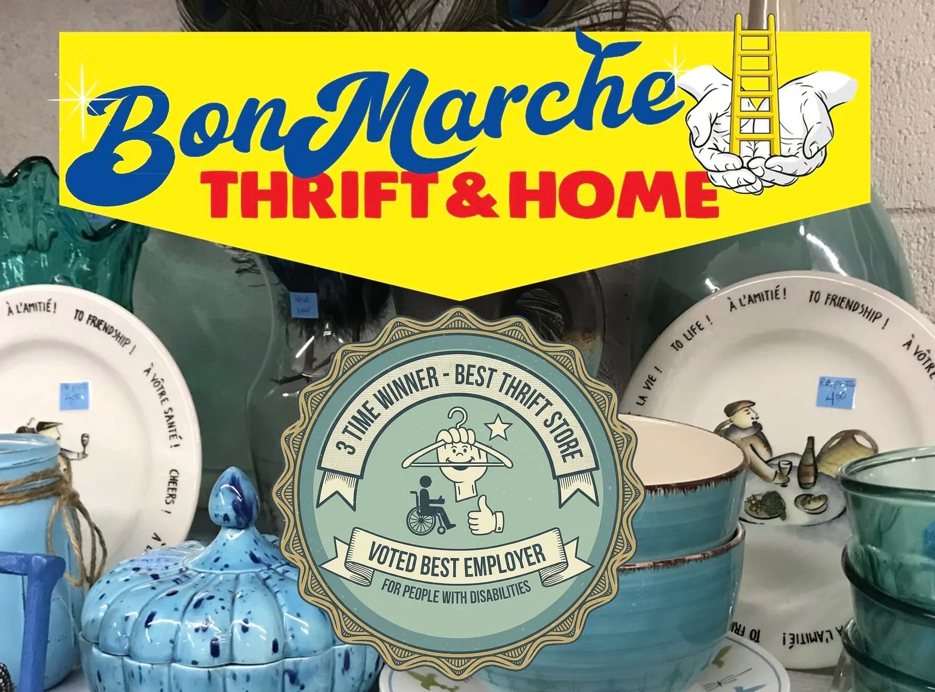 A yellow sign that reads "Bon Marché Thrift & Home" with a graphic of hands holding a ladder. Below, decorative plates and a blue ceramic pumpkin are visible on a display shelf.