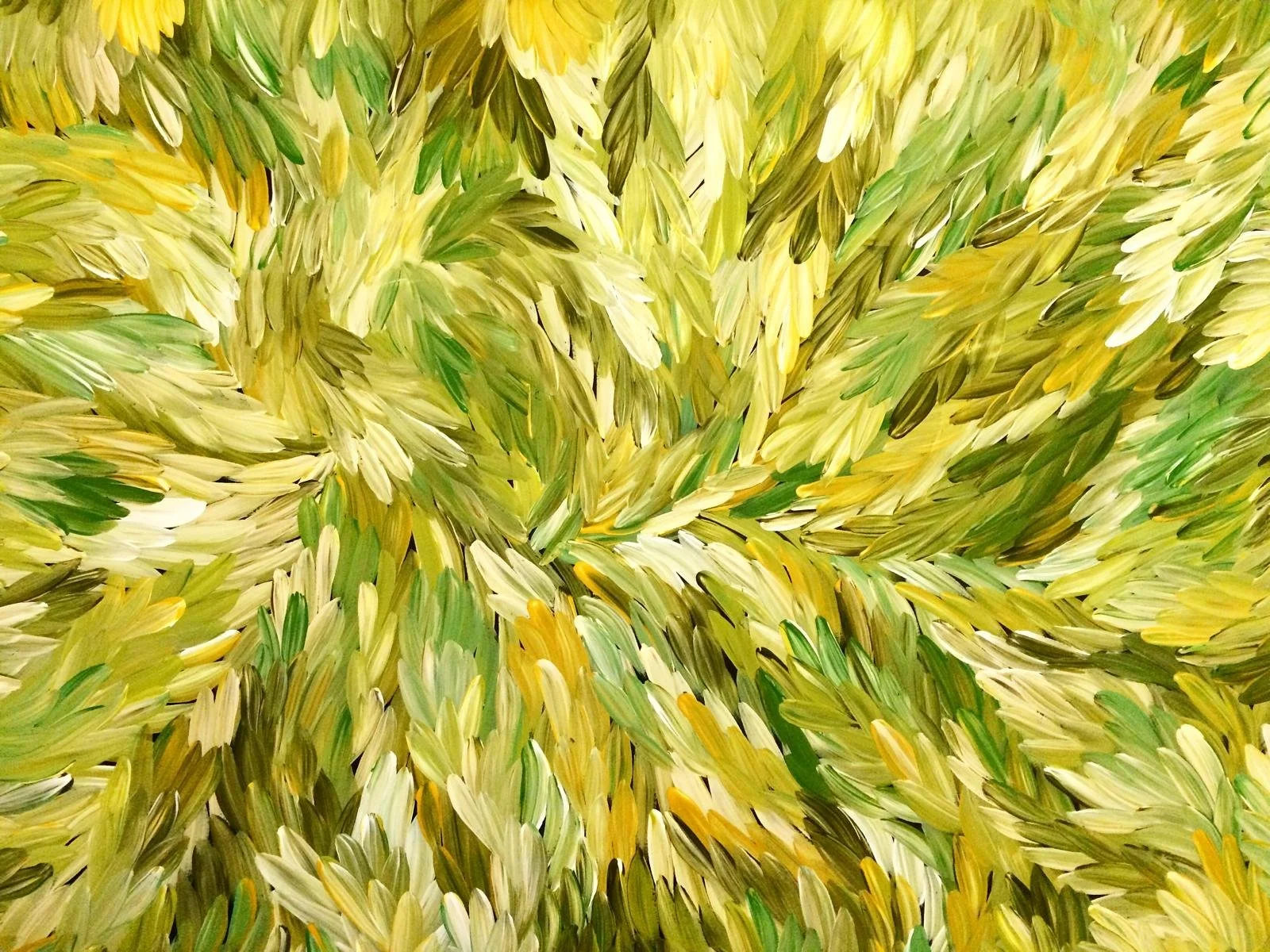 Abstract pattern of yellow, green, and white brushstrokes in swirling motion.