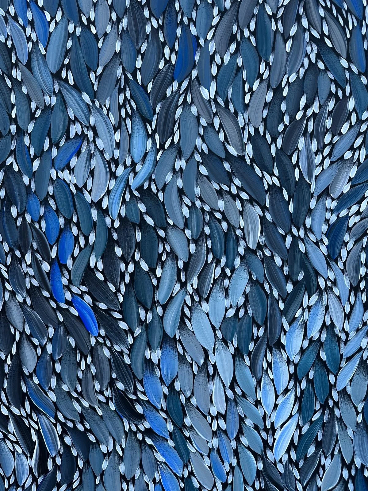 Abstract painting with numerous blue, gray, and black elongated leaf-like shapes layered densely together.