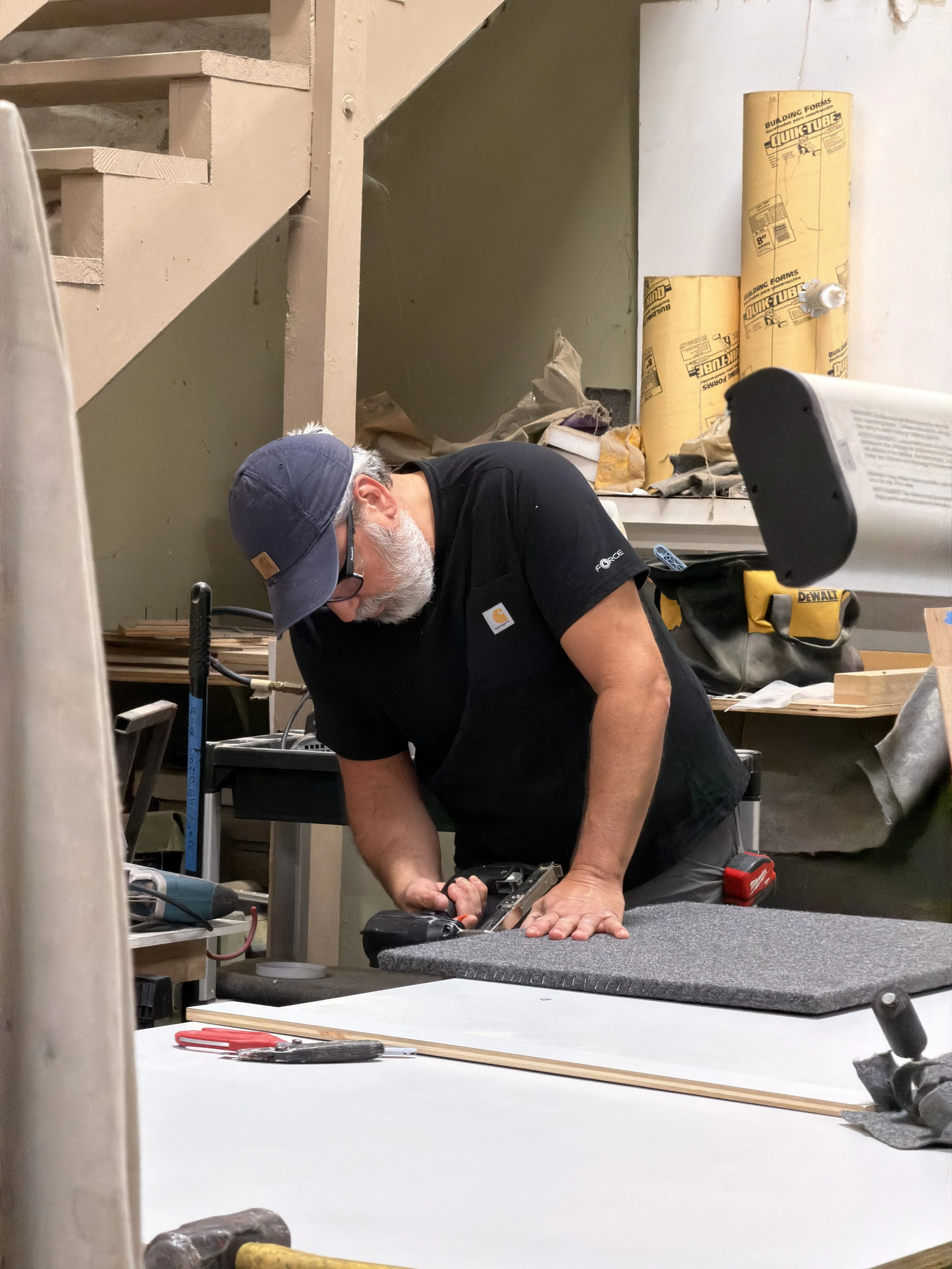 Image of carpet being wrapped around wood