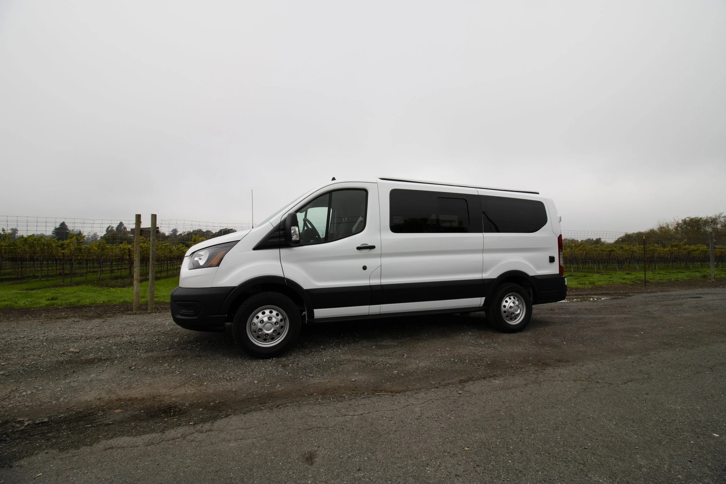 white ford transit on a cloudy day