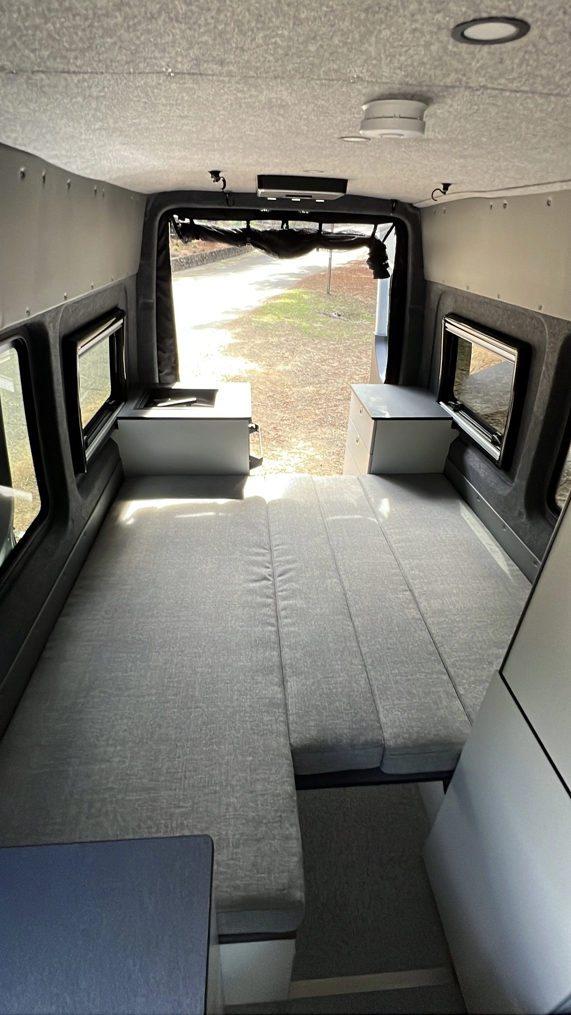 a bed inside a van