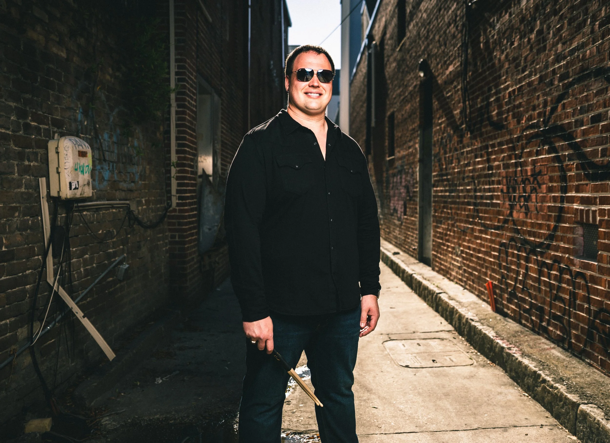 Alley with sunglasses & sticks.jpg