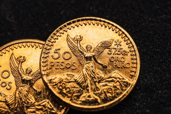 Dos monedas Centenario de oro mexicano disponibles para compra y venta con cotizaciones actualizadas.