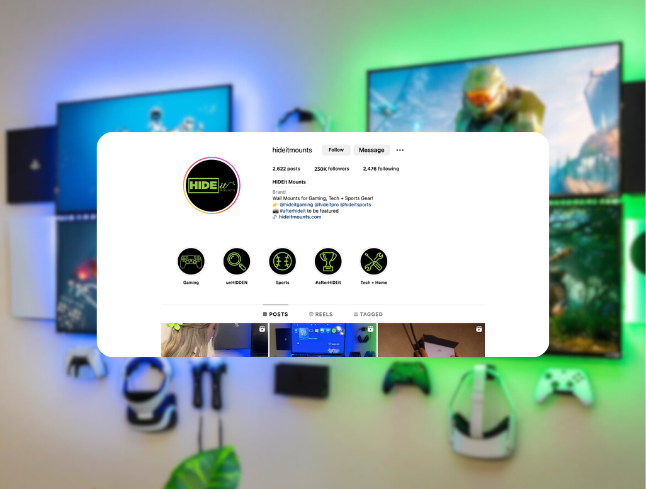 Instagram profile page for HIDEit Mounts with gaming-themed icons and posts, displayed over a wall with mounted screens and gaming controllers.
