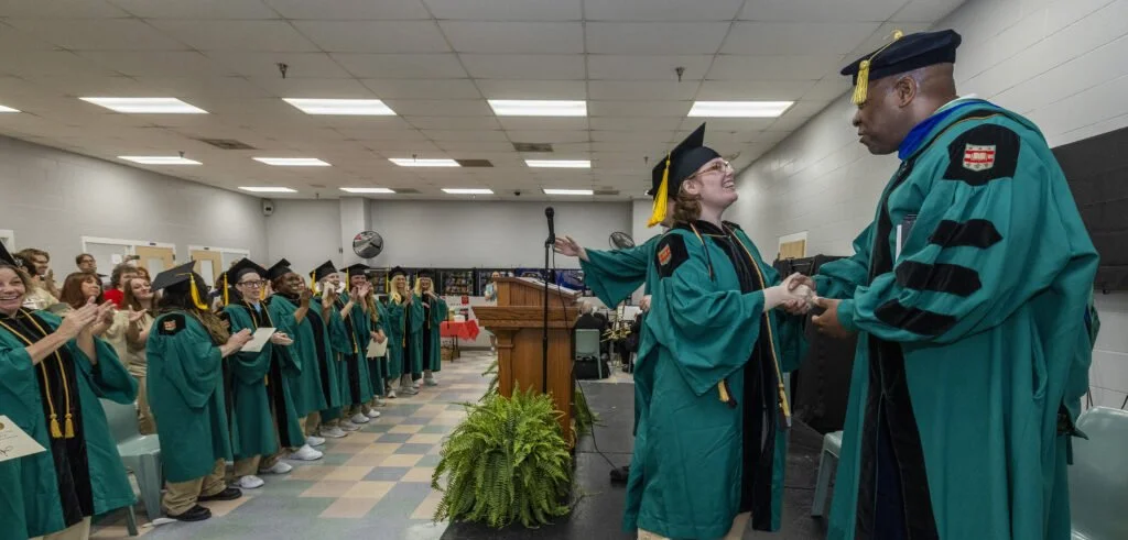 Inmates celebrating at their graduation