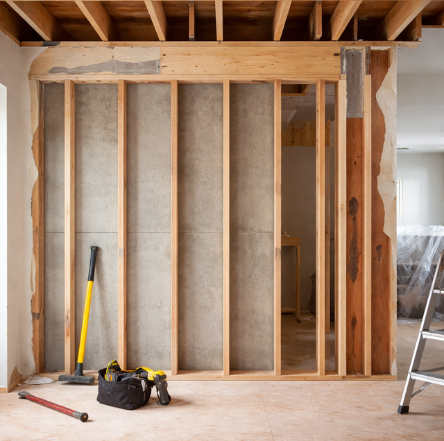 interior wall with floor joists running perpendicular above
